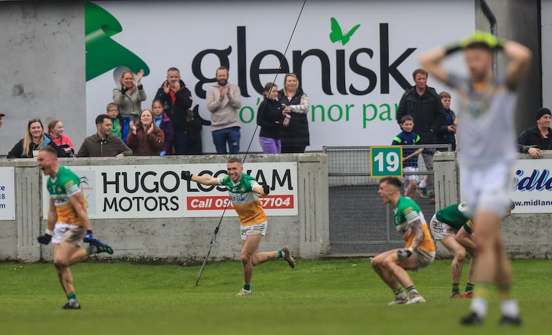 Delighted Offaly players celebrate the victory over Meath at O'Connor Park, Tullamore. Photograph: Evan Treacy/Inpho