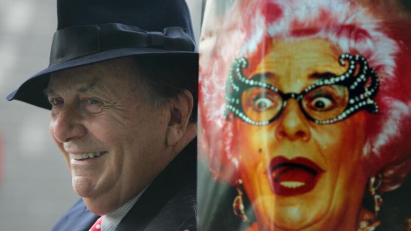 Above, the Australian comedian and TV show host Barry Humphries in Dublin in 2009, beside a poster of his alter-ego  Dame Edna Everage. Photograph: Bryan O’Brien