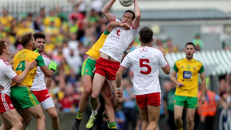 Tyrone’s Colm Cavanagh beats Donegal’s  Michael Murphy to the ball. Tyrone worked hard to curtail Murphy and another key man, Ryan McHugh. Photograph: Laszlo Geczo/Inpho