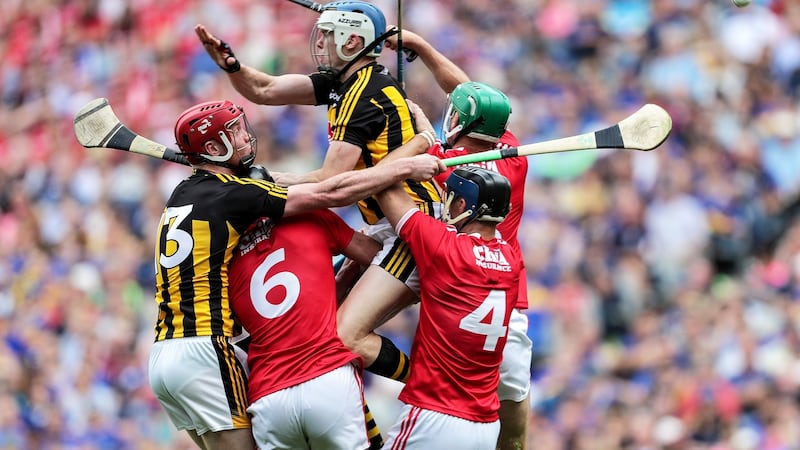 Kilkenny’s TJ Reid and Adrian Mullen challenge Mark Ellis and Stephen McDonnell of Cork during their All-Ireland quarter-final meeting at Croke Park. Photograph: Laszlo Geczo/Inpho