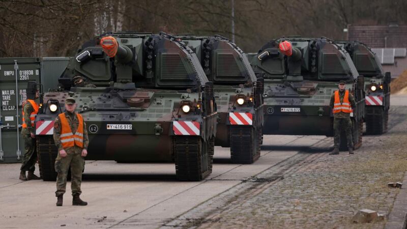 Soldiers of the German Bundeswehr prepare Panzerhaubitze PZH 2000 155mm self-propelled howitzers for transport to Lithuania, from Munster, Germany. Germany is sending an additional 350 soldiers and heavy equipment to its current deployment in Lithuania, where it leads a Nato Enhanced Forward Presence Battle Group. Photograph: Sean Gallup/Getty