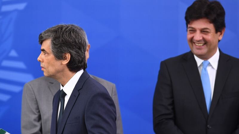 Brazil’s sacked health minister Luiz Henrique Mandetta (right)  looks at his successor  Nelson Teich during his swearing-in ceremony at Planalto Palace in Brasília on April 17th. Photograph: Evaristo Sa/AFP via Getty Images