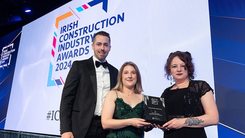 Lucy Farrell, marketing coordinator at Pennypop, presents the green project of the year award to Barry Casey and Rose Mac Sweeney, RKD