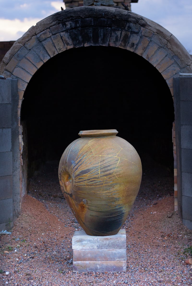 John Domenico, Kintsugi Jar II, 2016. Wood-fired ceramic with kintsugi repair, shown in front of the Denver anagama kiln. Photograph: John Domenico