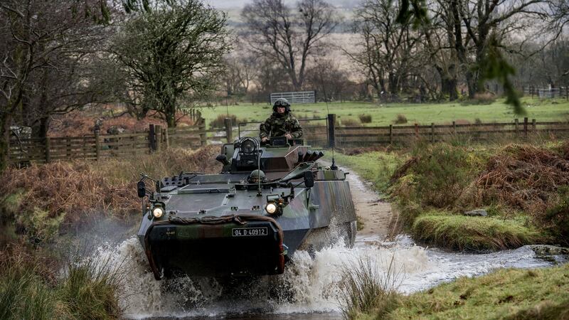 The Irish Defence Forces crossing the Slaney River during a mission readiness exercise in the Glen of Imaal, Co Wicklow. President Michael D Higgins said    many are understandably concerned about the ability to attract and retain people of the highest calibre in the Defence Forces. File photograph: Brenda Fitzsimons/The Irish Times