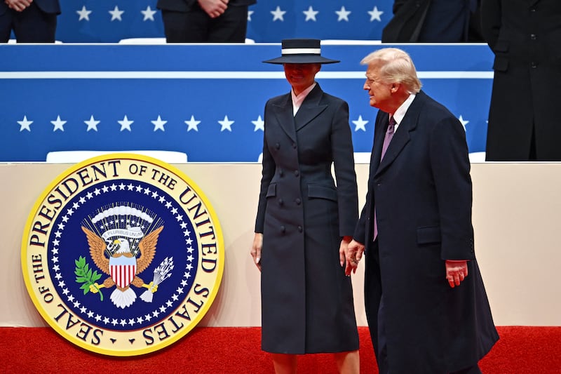 Donald Trump and Melania Trump walk out of stage at the end of the inaugural parade on Monday. Photograph: Angela Weiss/AFP via Getty 