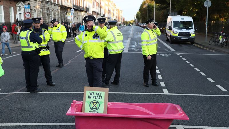 Gardaí at Merrion Square  as Extinction Rebellion activists obstruct traffic in the area. Photograph: Nick Bradshaw