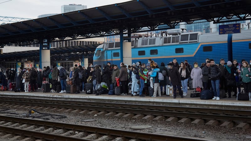 People wait for a delayed train to the west of Ukraine in Kyiv. Photograph: Pierre Crom/Getty Images