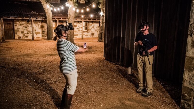 Joan Schaan takes a photo of her son Daniel (15) as he prepares for a night boar hunt at the Ox Ranch in Uvalde, Texas. Photograph: Daniel Berehulak/New York Times