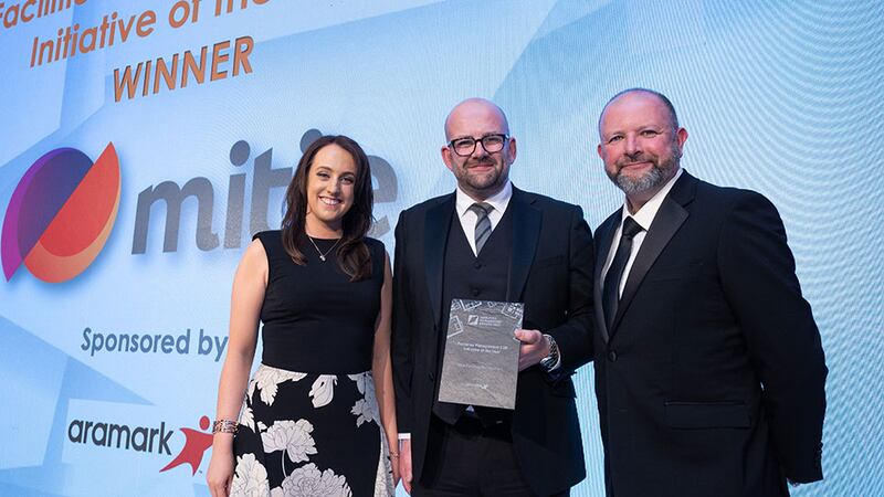 Jason Keegan, operations director at Aramark, presents the Facilities Management CSR Initiative of the Year award to Orla Kennedy and Stephen Connolly, Mitie Facilities Management.