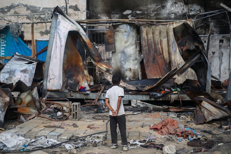 A Palestinian boy looks at destroyed shelters at the site of an Israeli air strike which hit tents for displaced people two days earlier in the courtyard of Al-Aqsa Martyrs Hospital in Deir al-Balah in the central Gaza Strip on October 16th. Photograph: Eyad Baba/AFP via Getty