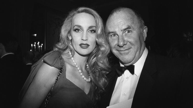 Clive James with model Jerry Hall at the Baftas in 1990. Photograph:  PA