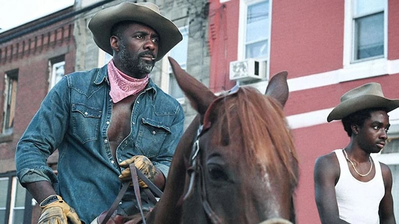 Idris Elba and Caleb McLaughlin in Concrete Cowboy