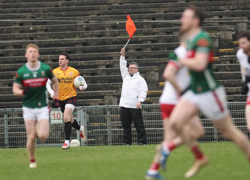 The umpire signals a two-point score during the Division 1 game between Mayo and Tyrone in Castlebar. Photograph: James Crombie/Inpho