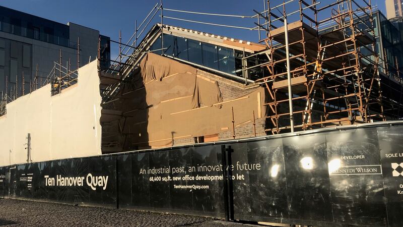 On Dublin’s Hanover Quay,  US developer Kennedy Wilson is building an office block behind the retained triple gables of an old warehouse. Photograph: Frank McDonald