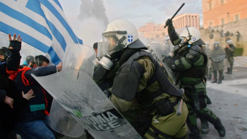 The world is now so interconnected that the failure of one political system could take the rest of us down with it’: clashes in the streets in Athens, in 2012, as the Greek parliament prepared to vote on an EU/IMF austerity deal. Photograph: Milos Bicanski/Getty