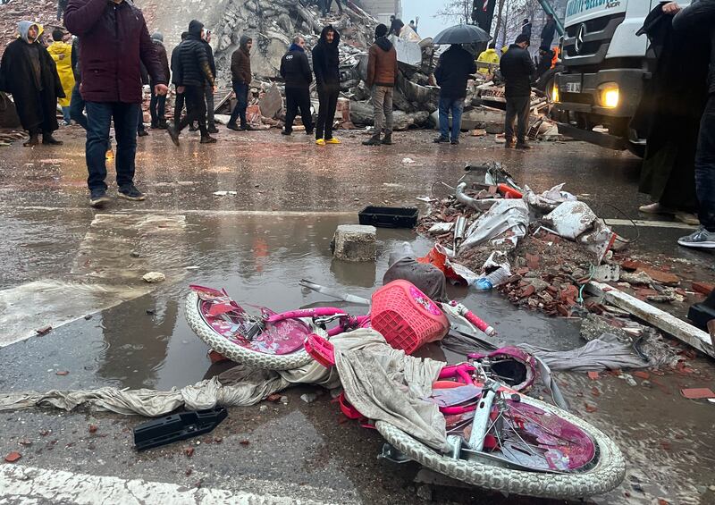 A bicycle lies damaged as rescuers search for survivors through the rubble in the Turkish city of Sanliurfa, after a 7.8-magnitude earthquake struck the country's south-east. Photograph: STR/AFP/Getty Images)