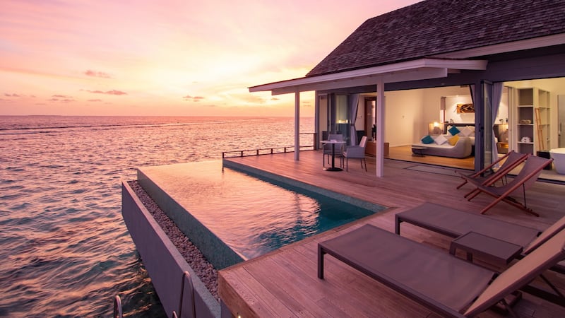 The real charm of the over water villas is the large deck, with steps leading directly down into the ocean.