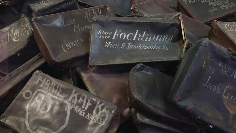 Suitcases confiscated from Auschwitz prisoners lie in an exhibtion display at the former Auschwitz  concentration camp. Photograph: Sean Gallup/Getty Images