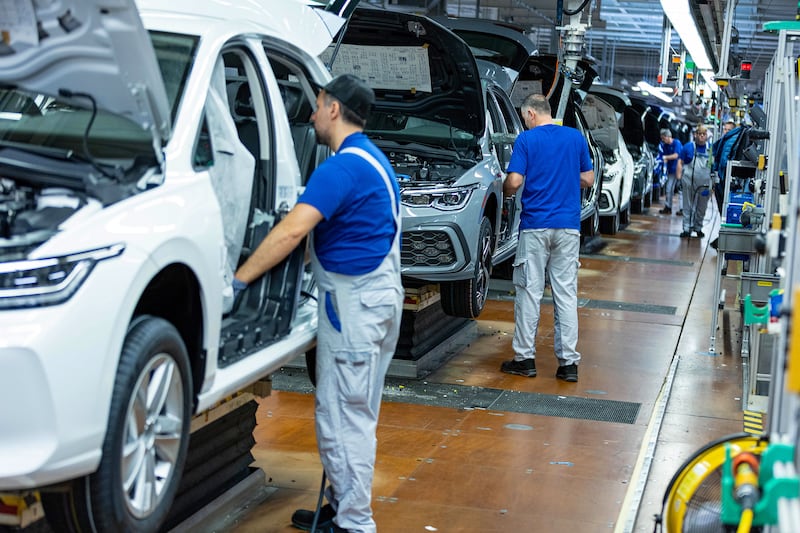 Workers on the VW Golf assembly line. Photograph: Krisztian Bocsi/Bloomberg/Getty