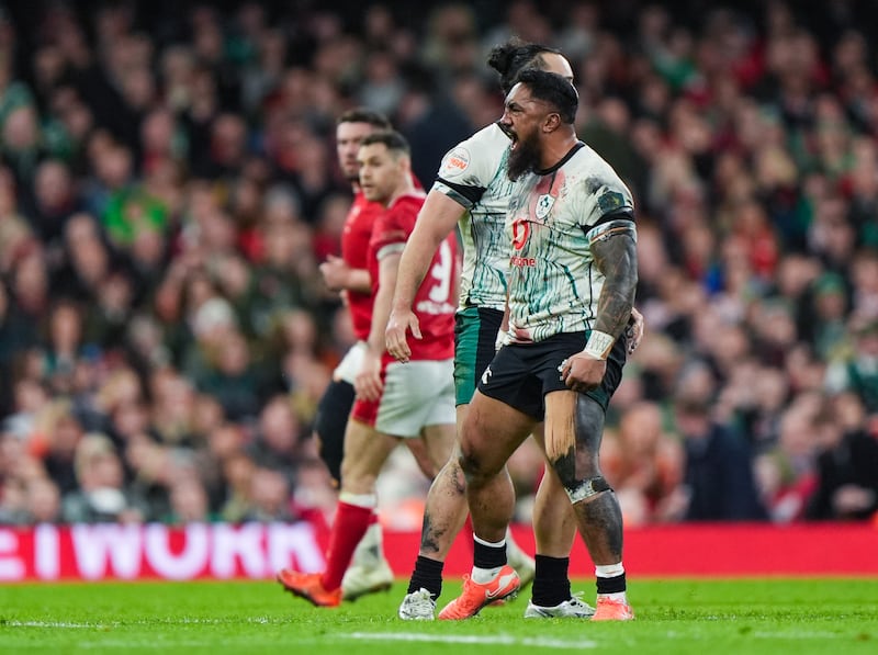 Ireland's James Lowe and Bundee Aki celebrate winning a penalty at the Principality Stadium. Photograph: Joe Giddens/PA Wire