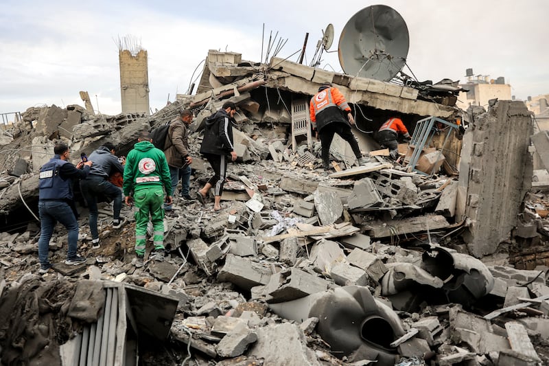 People and first responders inspect the rubble of a collapsed residential building that was hit by Israeli bombardment in the Saraya area in al-Rimal in central Gaza City on January 4th. Photograph: Omar Al-Qattaa/AFP via Getty