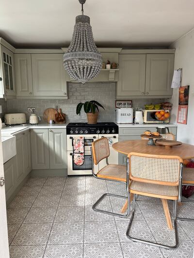 The kitchen was a sage green, with light green tiles