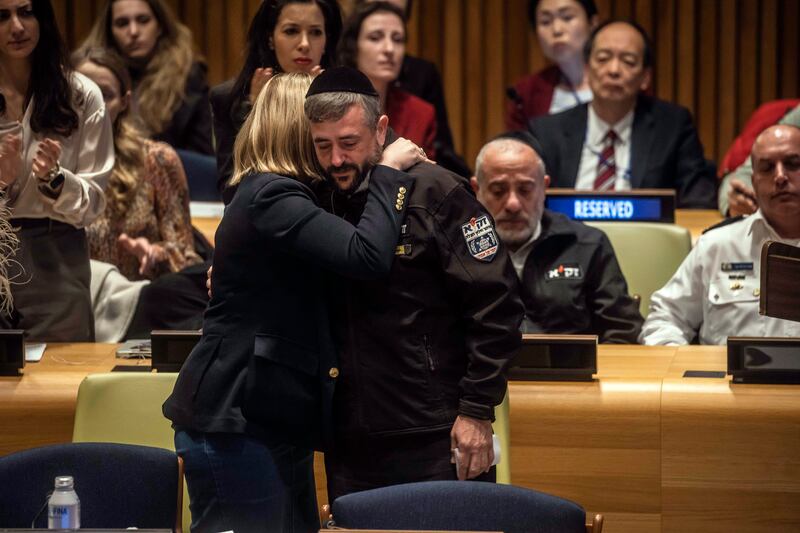 Simcha Greinman, a volunteer emergency worker in Israel, is embraced after speaking during a panel presentation at the United Nations highlighting reports of Hamas attackers committing widespread sexual violence during the October 7th assault on Israel. Photograph: Dave Sanders/New York Times
                      