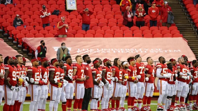 The Kansas City Chiefs stand with locked arms before the start of their game against the Houston Texans. Photograph: Getty Images