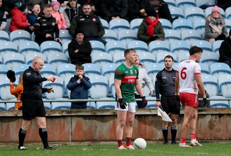 Referee Barry Cassidy red cards Tyrone's Michael McKernan. Photograph: James Crombie/Inpho