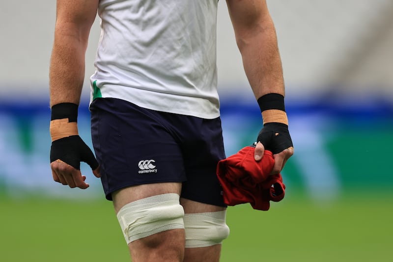 Ireland's James Ryan plays with strapping on his hands during the Captain's Run at the Stade de France. Photograph: Billy Stickland/Inpho