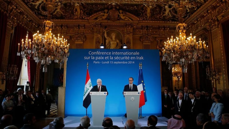 French president Francois Hollande and Iraq’s president Fuad Masum attend the opening of an international conference bringing together about 30 countries to discuss how to cooperate in the fight against Islamic State militants in Paris. Photograph: Christian Hartmann/Pool/Reuters