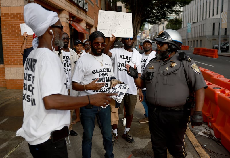 A policeman asks Blacks for Trump supporters to move to another area. Photograph: Joe Raedle/Getty Images