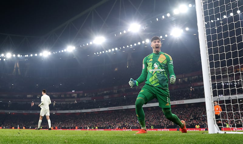 Manchester United goalkeeper Altay Bayindir celebrates after he saves the penalty of Arsenal's Kai Havertz. Photograph: Julian Finney/Getty Images