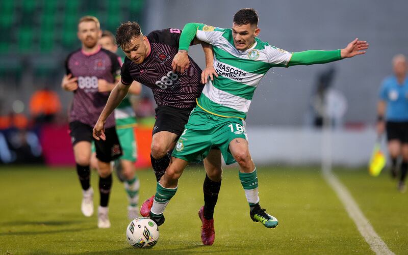 Shamrock Rovers’ Trevor Clarke and Archie Davies of Dundalk. Photograph: Ryan Byrne/Inpho