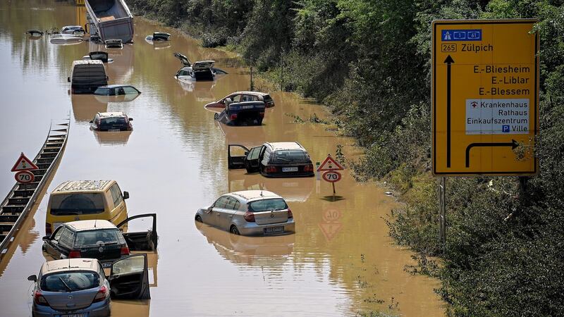 Flooded  cars and trucks on the B265 federal highway in Erftstadt, Germany, on Saturday. Large parts of western Germany were hit by heavy, continuous rain on Wednesday, resulting in  flash floods that destroyed buildings and swept away vehicles. Photograph: EPA