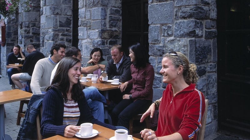 Enjoying coffee at Spanish Arch, Galway.