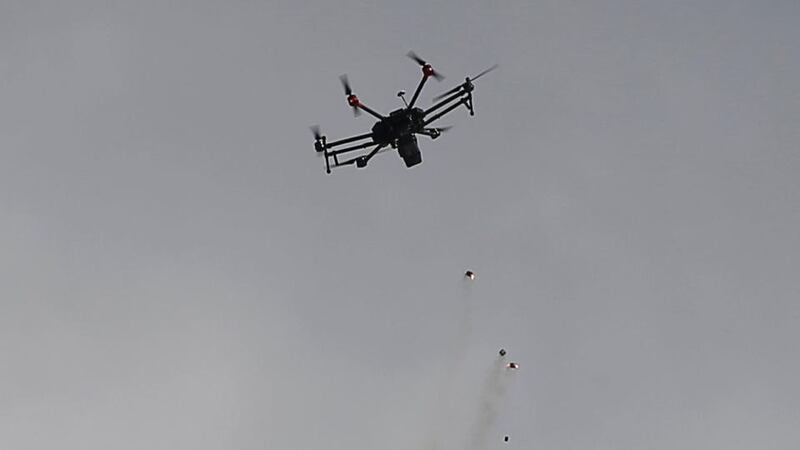 An Israeli drone drops tear gas grenades during clashes with Palestinians along the border with Gaza. Photograph: Mohammed Salem/Reuters