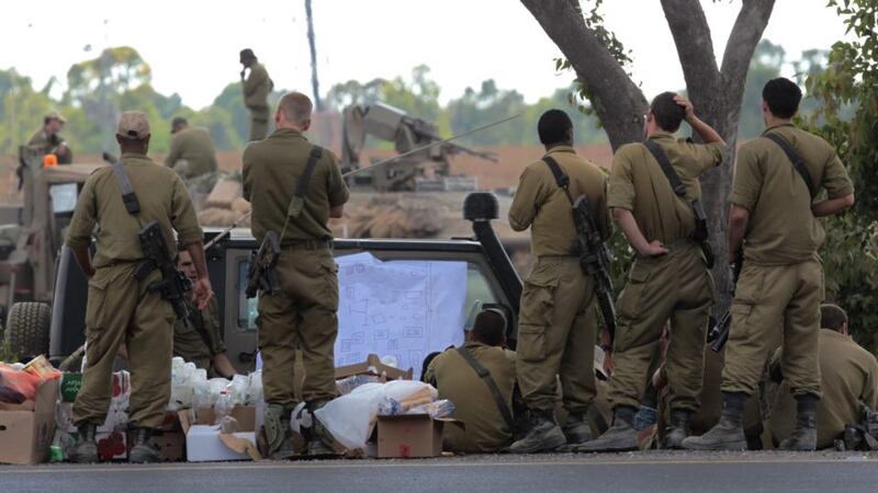 Israeli soldiers attend a military briefing close to the border with the Gaza Strip today. Photograph: Jim Hollander/EPA.