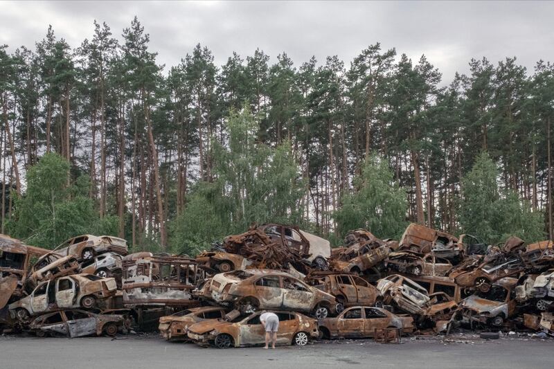 Burnt cars are piled up after being cleared from the streets of Irpin, a suburn of Kyiv, Ukraine, on July 3rd. Photograph: Mauricio Lima/The New York Times