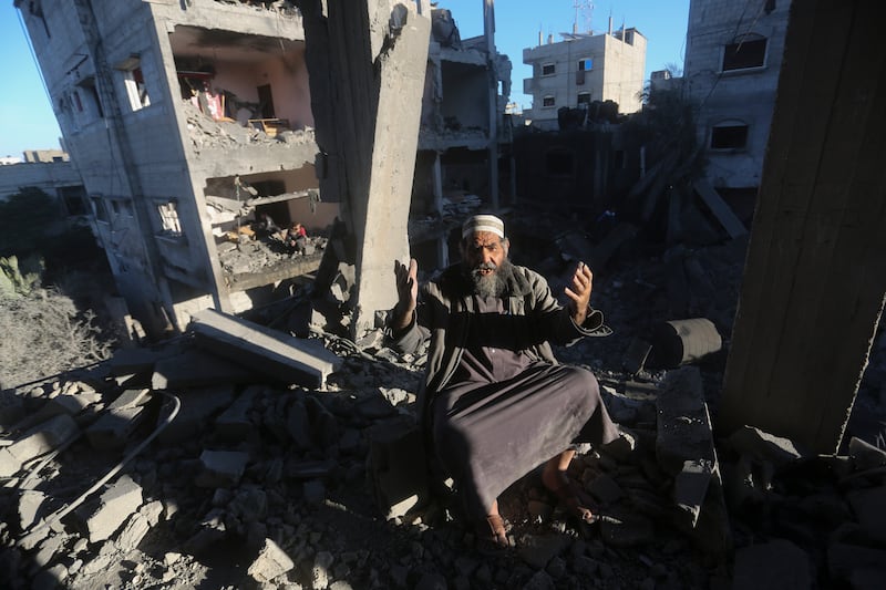 A Palestinian man reacts after an Israeli strike on residential buildings in Rafah, Gaza Strip, on Friday. Photograph: Hatem Ali/AP