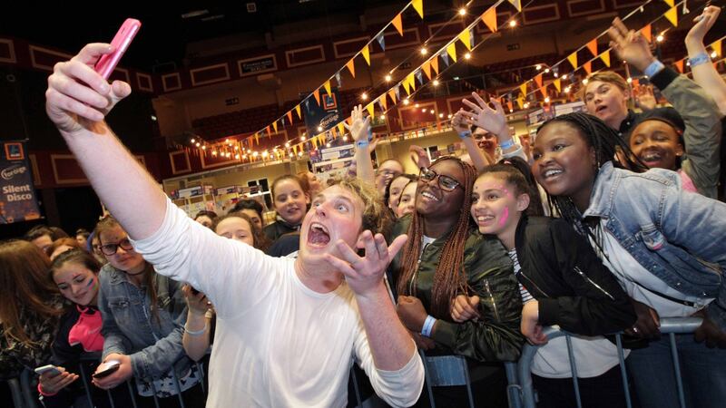 Seo Linn singer Stiofán Ó Fearail with fans at the Foróige Youth Citizenship Awards in the Citywest Hotel, Dublin.  Photograph: Mark Stedman