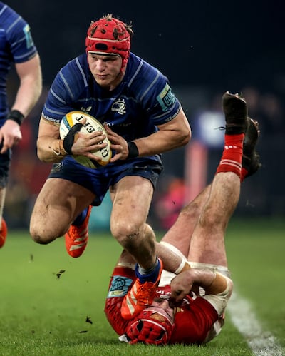 Leinster's Josh Van der Flier is tackled by Munster's John Hodnett   during the post-Christmas URC clash at Thomond Park. Photograph: Ben Brady/Inpho 