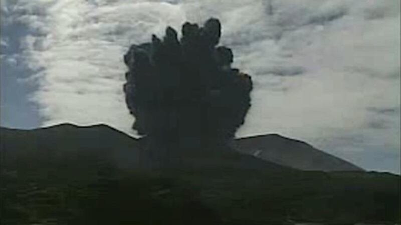 A video grab from the Japan Meteorological Agency’s live camera: The volcano erupted suddenly on Friday, blasting plumes of black smoke high into the sky, prompting authorities to order the evacuation of the island’s residents and forcing airlines to divert some flights. Photograph: Reuters/Japan Meteorological Agency