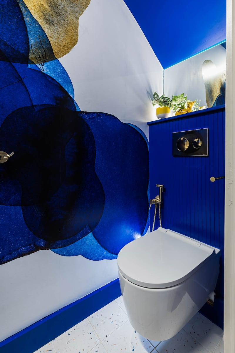 A wall-sized mural is used to dramatic effect in the guest WC