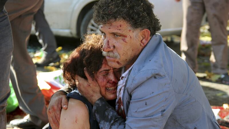 A couple hug after an explosion during a peace march in Ankara on Saturday. Photograph: Tumay Berkin/Reuters