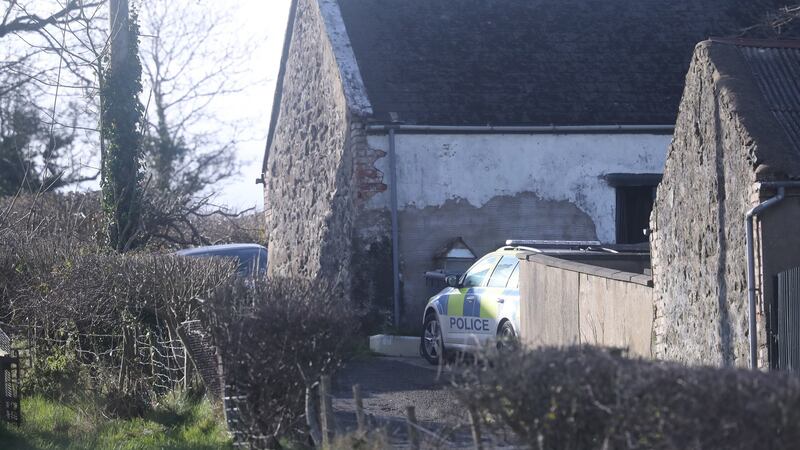 Police at the house just outside Larne in Co Antrim.  Photograph: Niall Carson/PA Wire