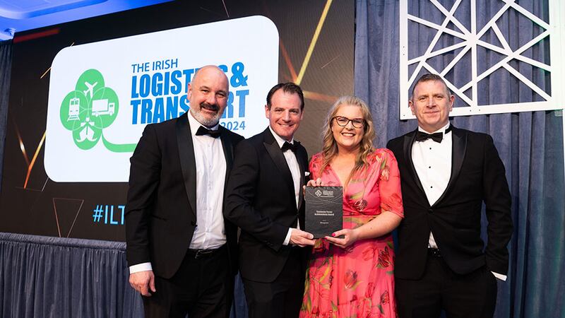 Seamus Kavanagh, executive officer, Irish International Freight Association presents the customer focus achievement award to the Musgrave team