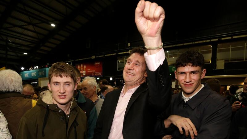 Green Party leader Eamon Ryan celebrates with his sons, Jack and Tom, after he was elected in Dublin Bay South. Photograph: Damien Eagers/The Irish Times