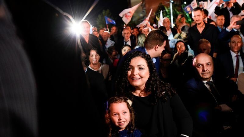 Vjosa Osmani, election candidate for prime minister from the opposition party Democratic League of Kosovo (LDK) sits with her daughter during an electoral rally in Pristina. Photograph: Armend Nimani/AFP via Getty